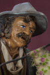 Italy Ceramic Man with Mustache and Hat Fixing Umbrellas in Sicily (Close Up)