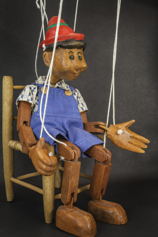 Italy Pinocchio  Jointed Marionette Sitting on Chair  (Side View)