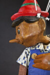 Italy Pinocchio Toy Puppet Marionette Sitting with Strings  (Close Up Profile)