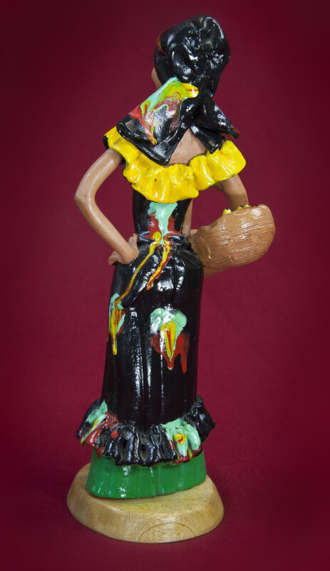 Jamaica Female Figurine with Head Scarf and Fruit Basket from Frazer's Ceramic (Back View)