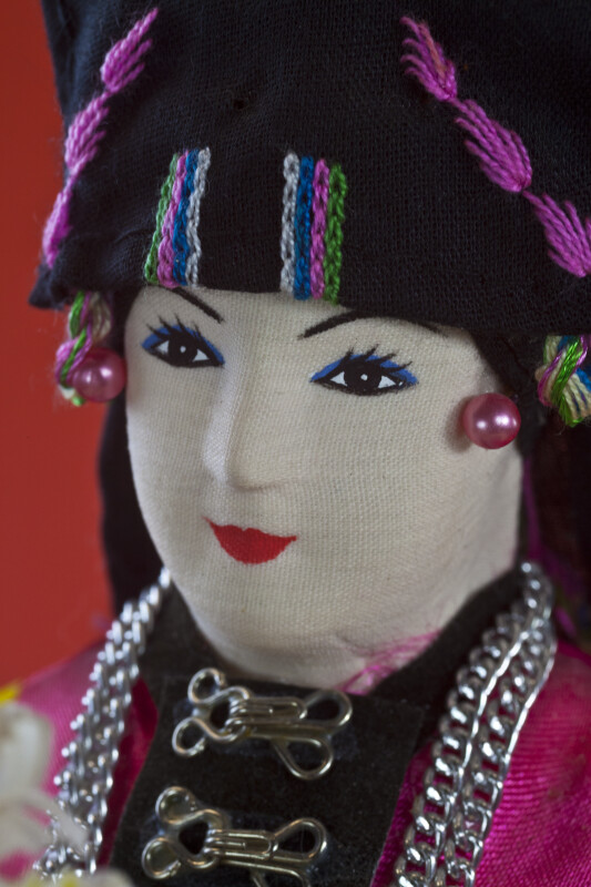Laos Female Figure with Hand Painted Fabric Face (Extreme Close Up)