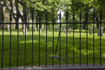 Looking through a Fence at Tablet Headstones