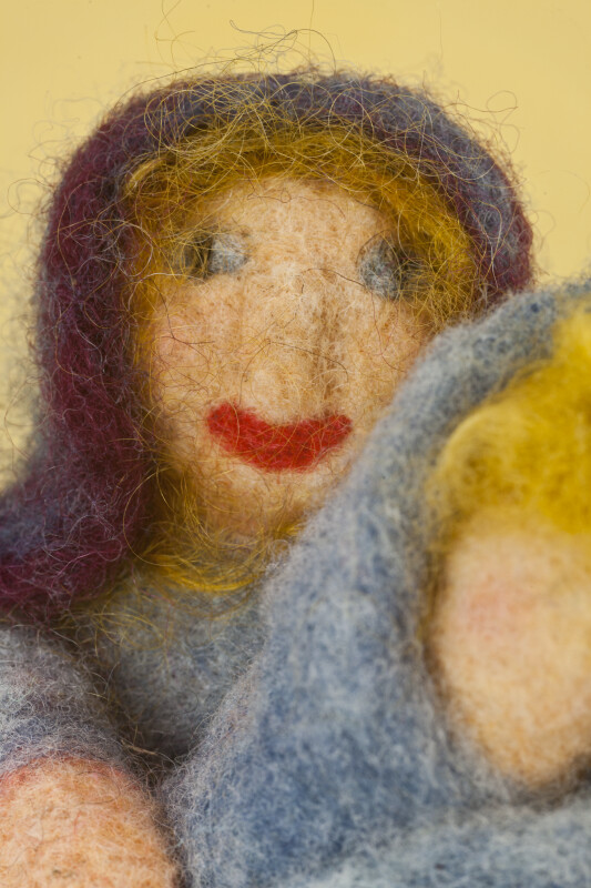 Maine Handcrafted Mother Holding Infant Dolls Made from Colored Needle Felted Wool (Close Up)