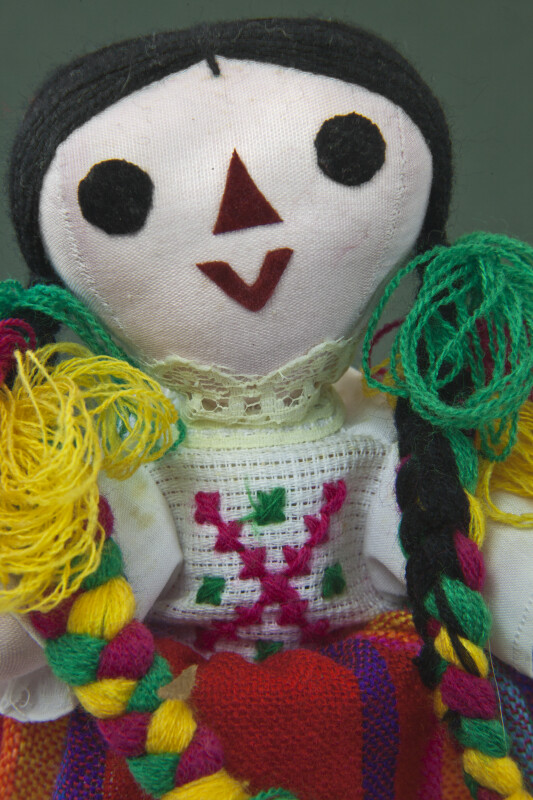 Mexico Jointed Doll with Felt Facial Features and Colorful Yarn Braids (Close Up)