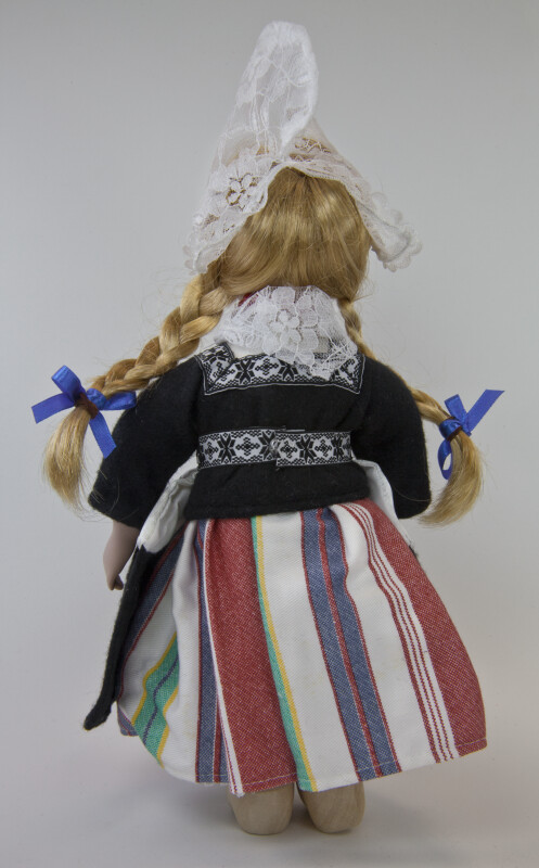 Netherlands Doll from Holland Wearing Traditional Costume with Peaked Cap, Wood Shoes, Karlap, Kletje, and Striped Skirt (Back View)