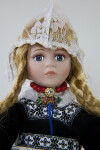 Netherlands Doll Wearing Traditional Peaked Dutch Cap Made of Lace (Close Up)
