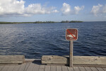No Fishing Sign on Boardwalk Overlooking Water