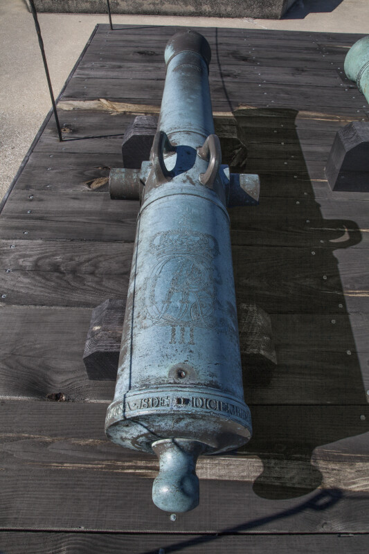 Oxidized, Bronze Cannon with Two Handles Located on Wooden Boards at Castillo de San Marcos