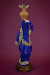Pakistan Women Traditional Clothing with Water Jug on Head (Back View)