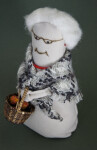 Prince Edward Island Handcrafted Woman Holding a Straw Basket with Balls of Yarn and Knitting Needles (Three Quarter View)
