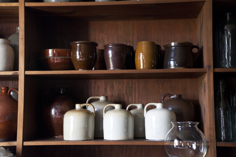 Redware and Stoneware on Shelves
