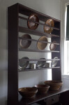 Redware and Tin Dinnerware on a Rack