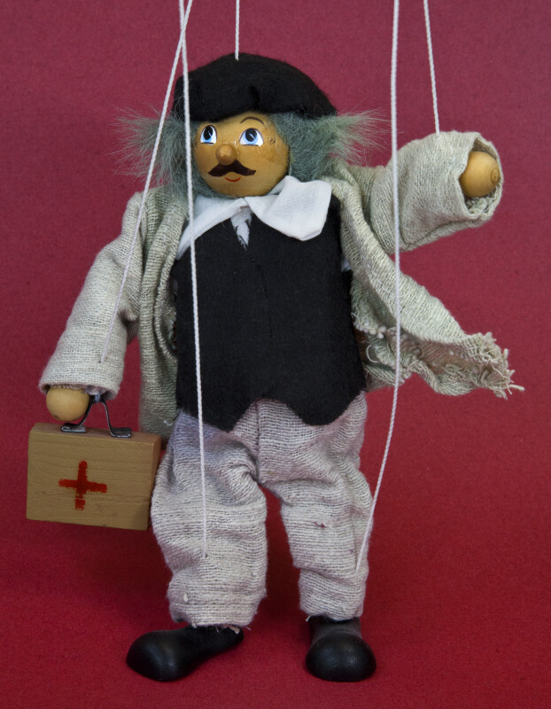 Romania Male Marionette with Wooden Case That Has a Red Cross (Full View)