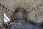 Room in Castillo de San Marcos with Wooden Benches and Stools