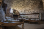 Room with Two Wooden Beds Adjacent to Entrance of Castillo de San Marcos