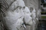 Sculpted Faces on a Masonry Wall