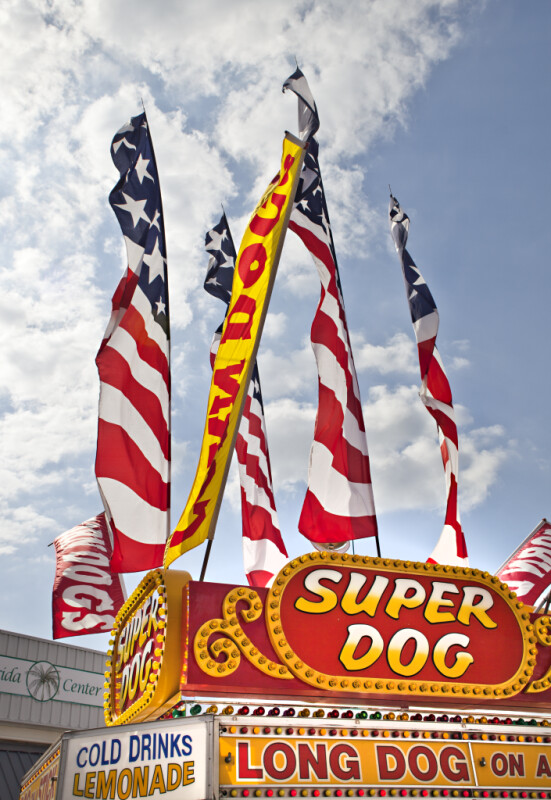 Skinny Flags Attached to Top of Hot Dog Stand