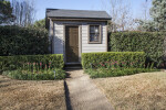 Small, Cozy Building with One Door and One Window at the San Antonio Botanical Garden