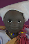 South African Figure Made with Stone-Fired Clay and Hand Painted Eyes (Extreme Close Up)