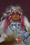 South Dakota Native American Chief with Hand Painted Face on Clay Wearing Feather Headdress (Close Up)