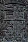 Spanish Symbols Carved Into a Bronze Piece