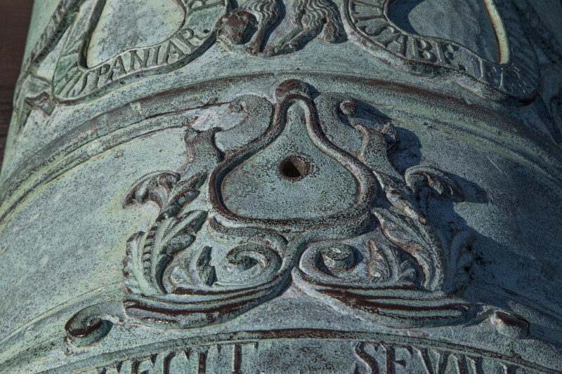 Symbols and Letters Written on an Oxidized, Bronze Cannon