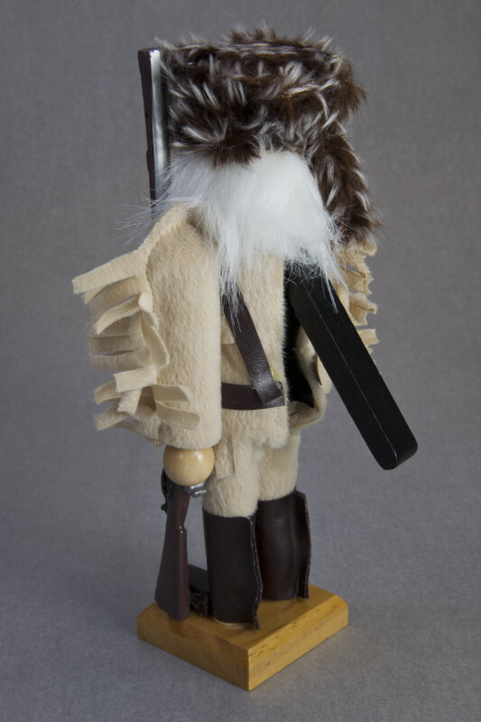 Tennessee Davy Crockett Nut Cracker Wearing Coonskin Hat with Raccoon Tail (Back View)