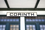 The Sign on the Exterior Wall of the Corinth Train Station
