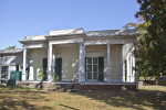 There are Pediments with Medallions above the Windows of the Curlee House