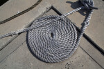 A Fiber Rope Wrapped around a Wooden Well Crank