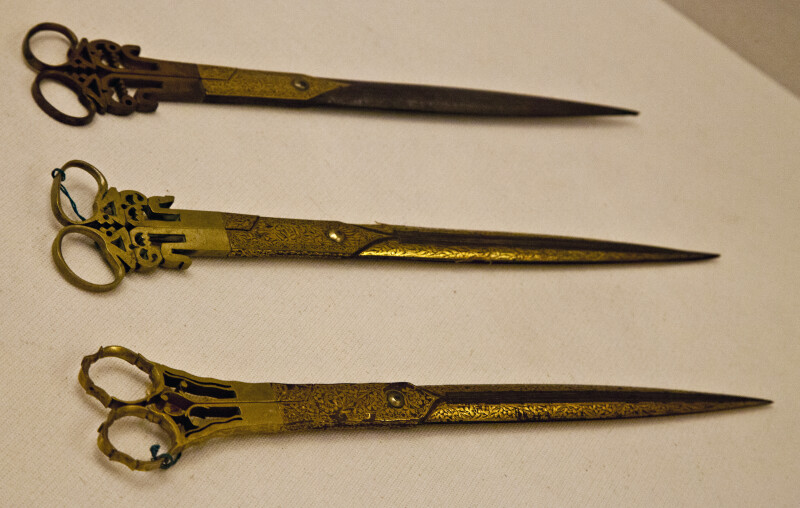 Three Pairs of Golden Scissors
