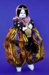 Turkey Female Doll Made from Stuffed Material and Wire Wearing a Loose Bright-Colored Dress (Full View)