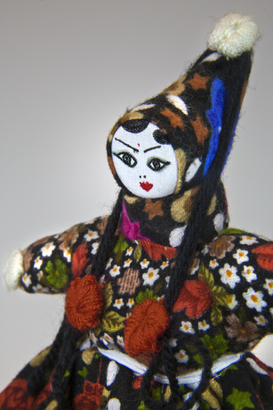 Turkey Female Doll with Peaked Head Scarf, Tassels, and Pom Poms (Close Up)
