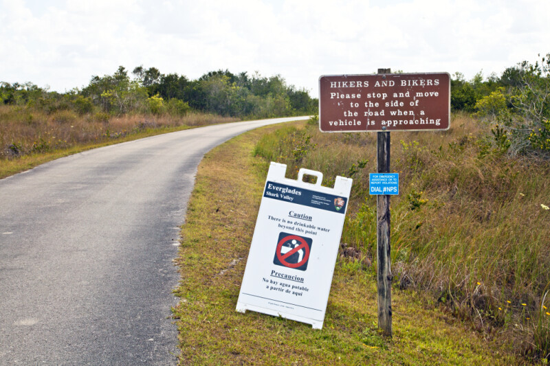 Two Warning Signs Along the Road at Shark Valley of Everglades National Park