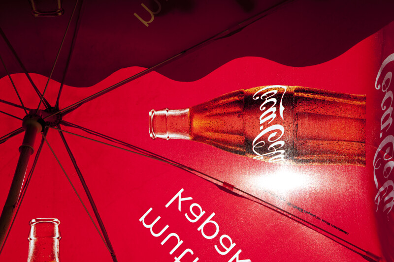 Underside of a Large, Red Umbrella Advertising Coca-Cola