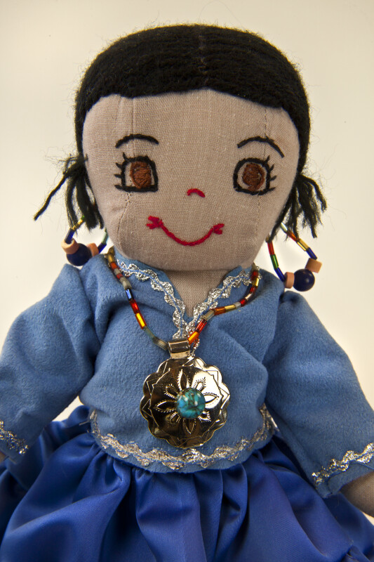 Utah Hand Made Indian Doll with Silver Medallion Necklace and Turquoise Earrings (Close Up)