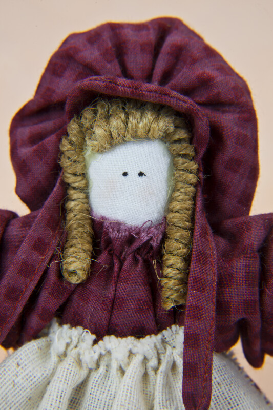 Utah Handcrafted Pioneer Lady with Curly Fiber Hair and a Cotton Bonnet (Close Up)