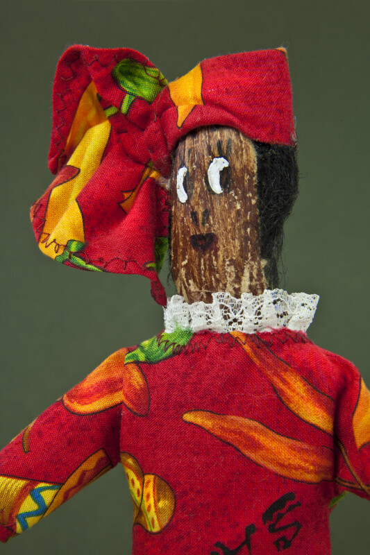 Virgin Islands Female Doll with Hand Painted Face on Mango Seed and African Style Head Scarf (Close Up)