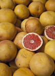 Whole and Halved Grapefruits on Display