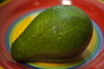 Whole Avocado on a Colorful Plate