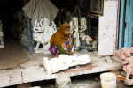 Woman Carving Deity Statue in Marble