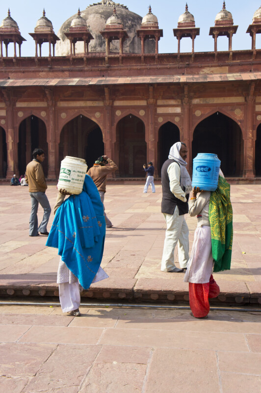 Women Carry Buckets towards Jami Masjid