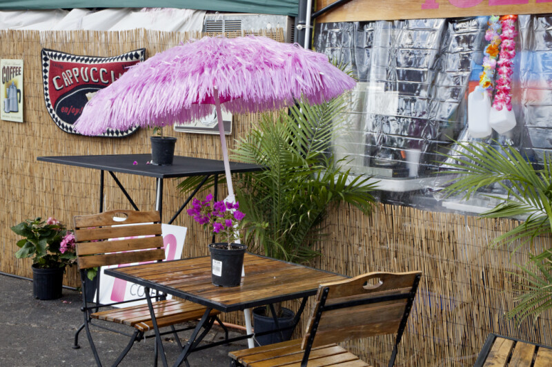Wooden Table with Pink Umbrella